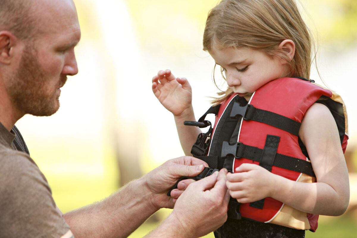 Child wearing life vest